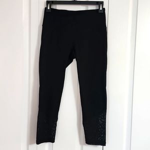 Victoria's Secret Sport black Capri leggings with sheer leopard print bottom. SM